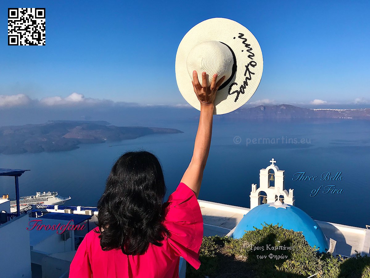 Greece Santorini Firostefani women in red holding a hat text 
