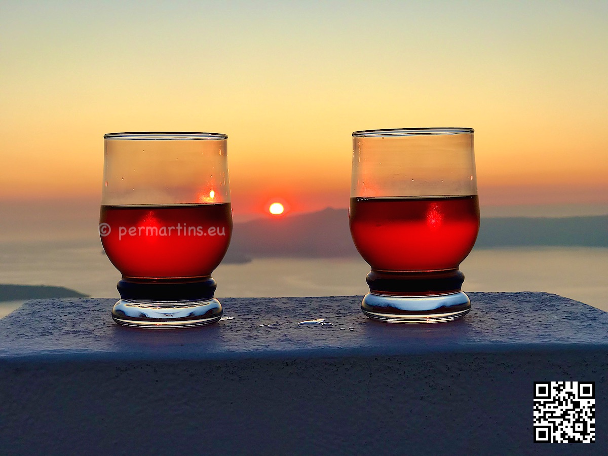 Greece Santorini two red drinks sunset.