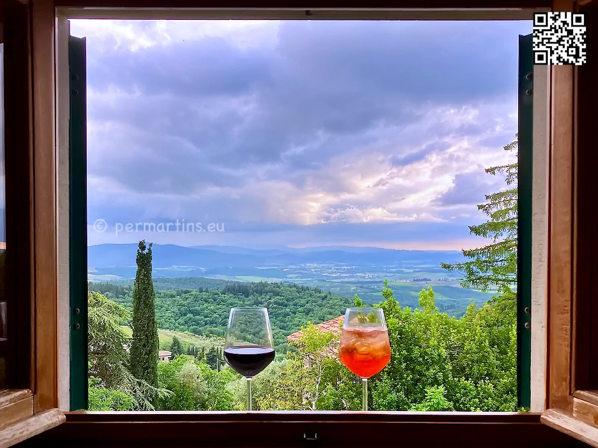 Italy Toscana Castellina in Chianti at Villa Godenano, room with a view over the landscape and glasses of wine and Aperol Spritz.