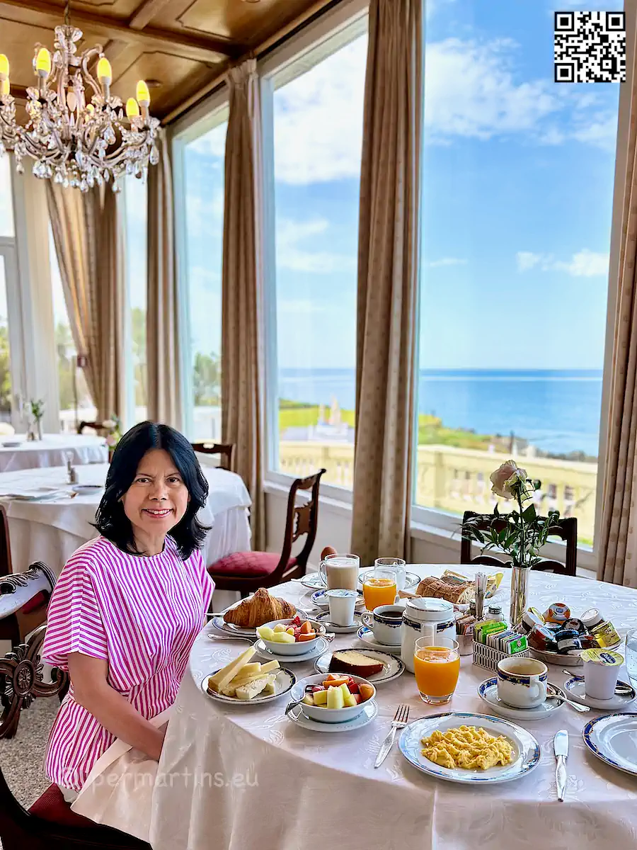 italy Sardinia Alghero Villa Las Tronas woman having a huge breakfast.