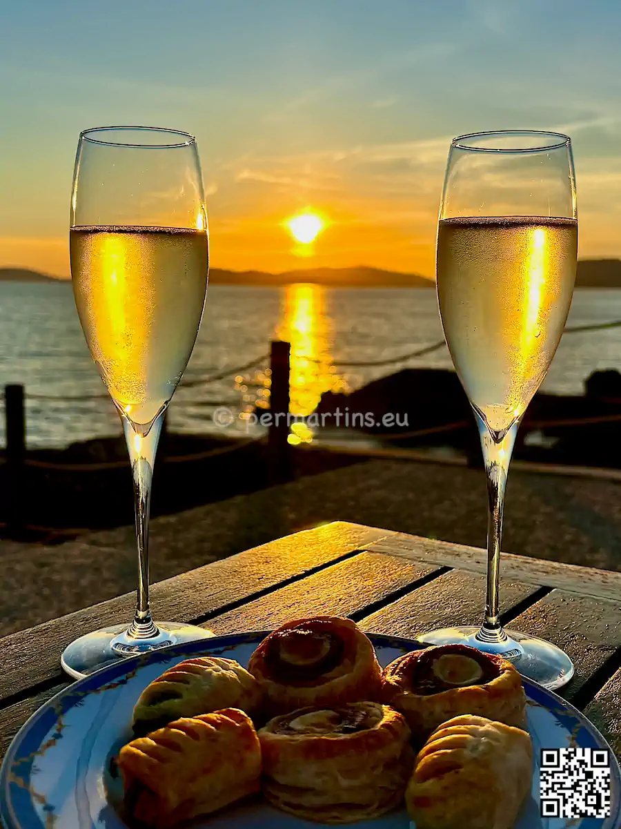 italy Sardinia Alghero Villa Las Tronas two glasses of prosecco at sunset.