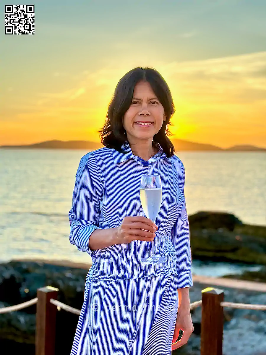 italy Sardinia Alghero Villa Las Tronas woman drinking prosecco at sunset.