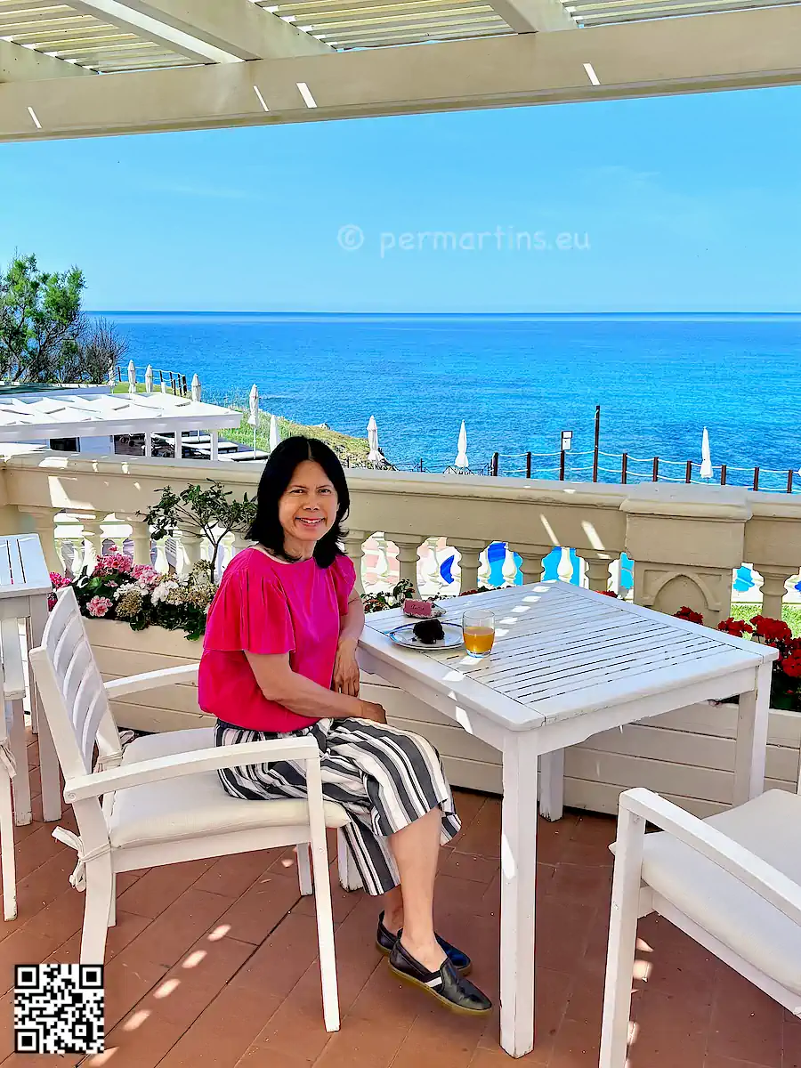 italy Sardinia Alghero Villa Las Tronas woman sitting at a terrace.