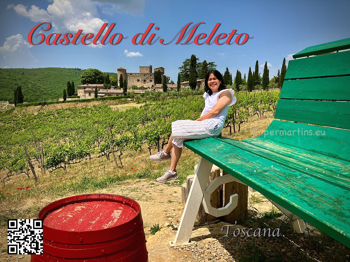 Italy Toscana Tuscany Castello di Meleto woman on a giant green bench.
