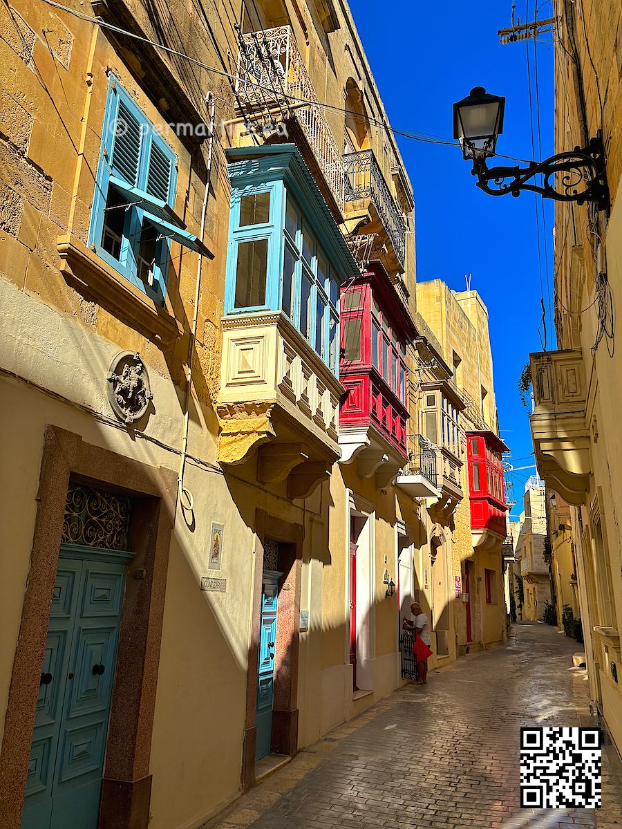 Malta Gozo Victoria / Citta’ ir-Rabat old town traditional buildings some with colourful wooden balconies