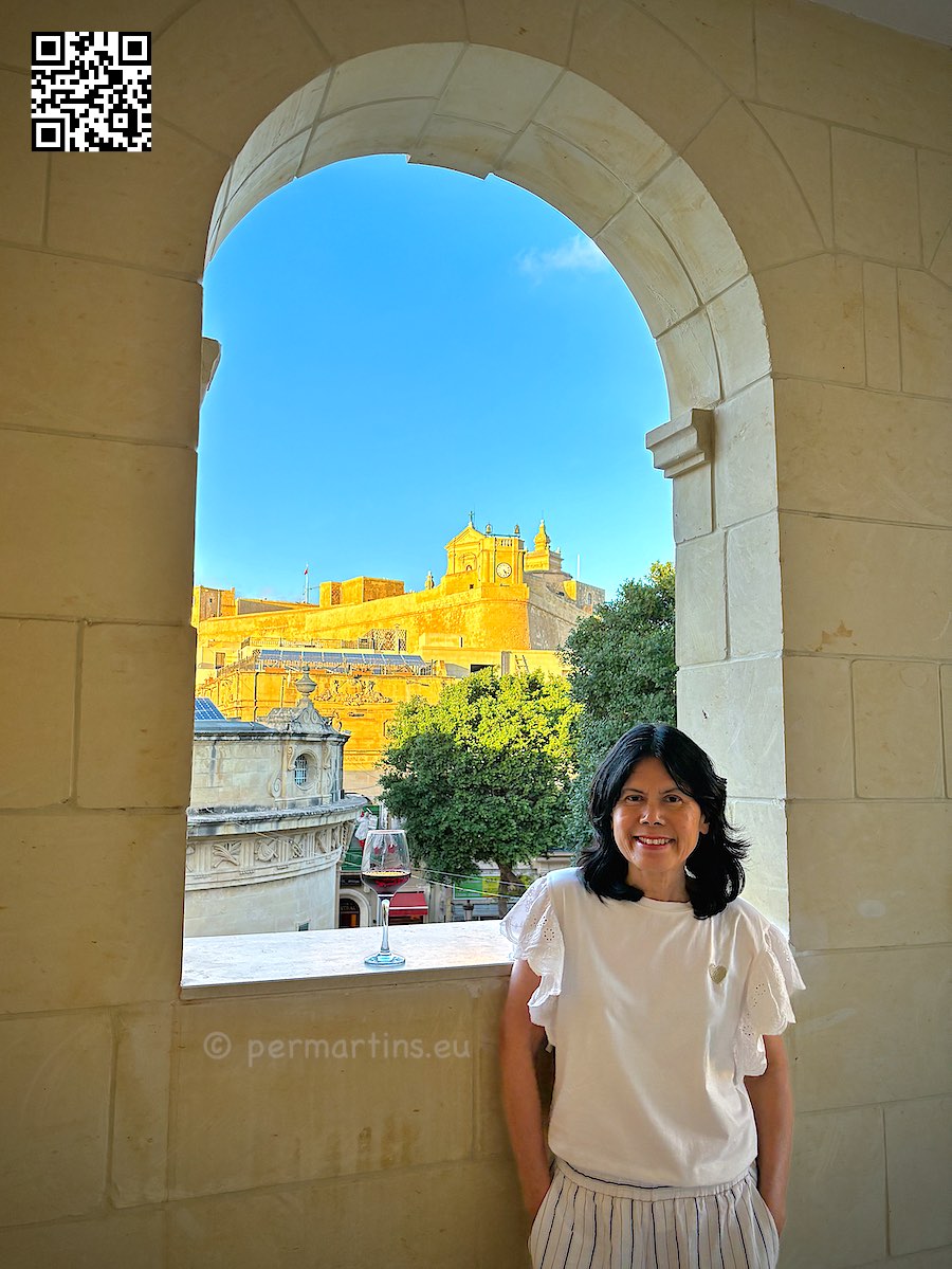Malta Gozo Victoria woman at Provicario hotel Cittadella in background.