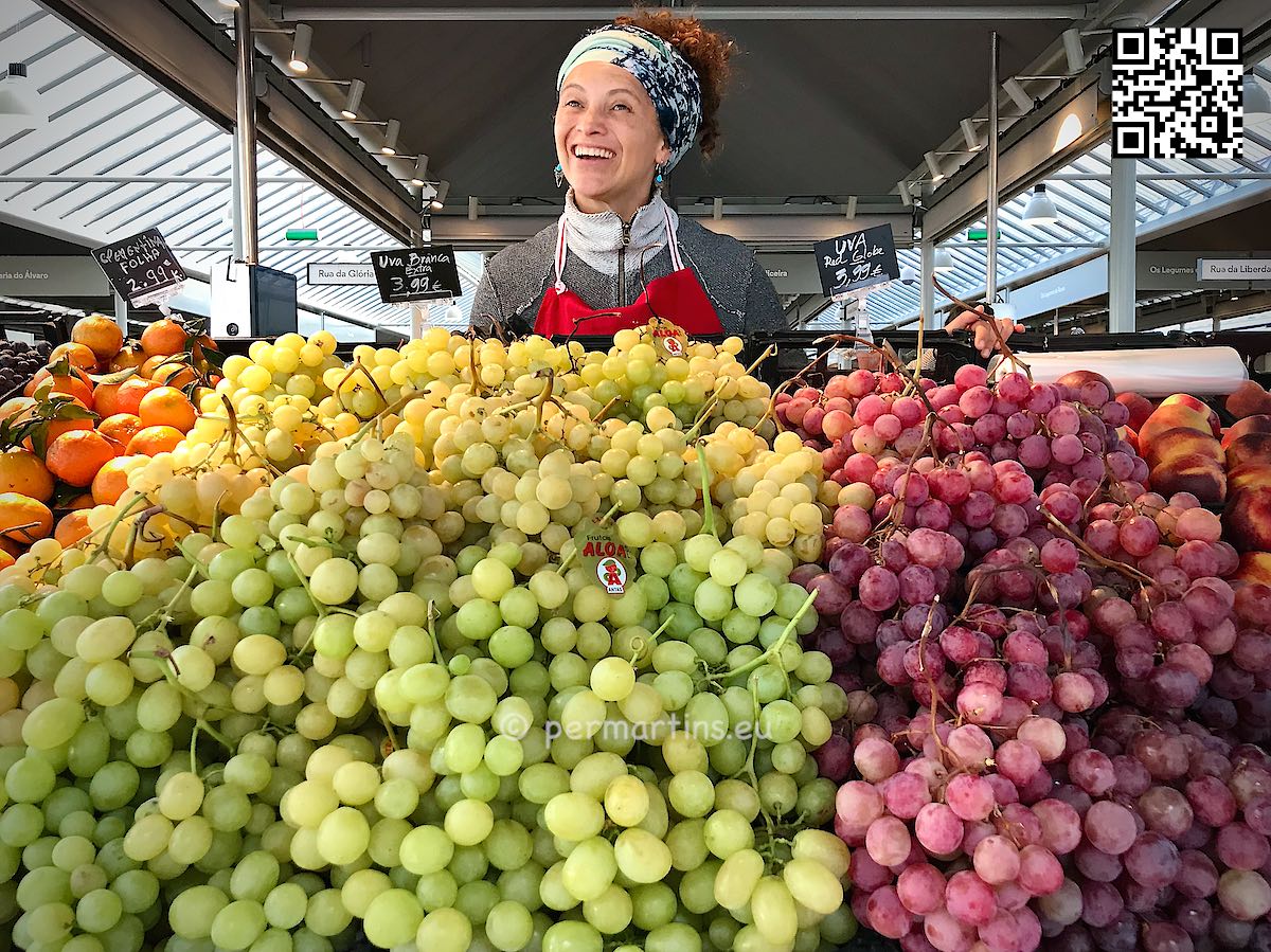 Portugal Porto Mercado do Bolhão market woman selling grapes.