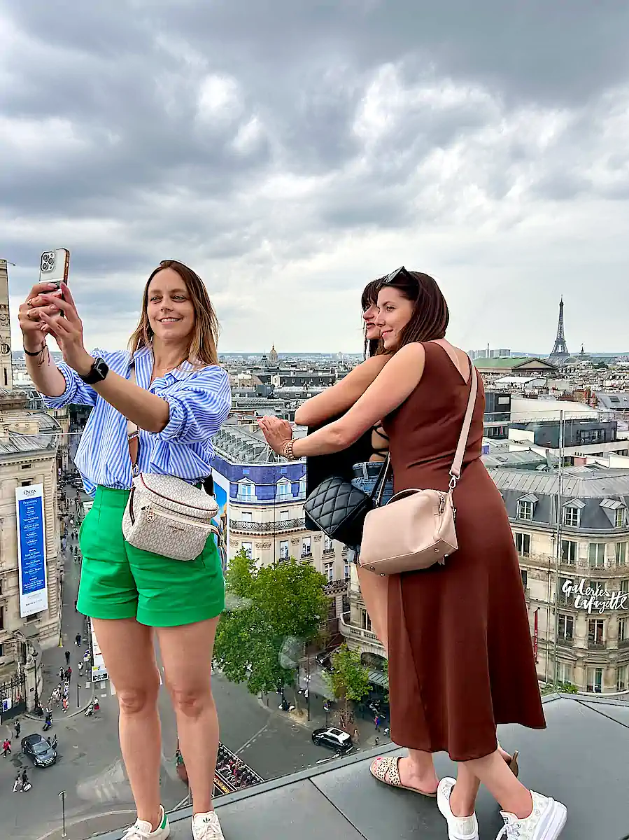 France Paris Lafayette women taking selfies on the roof