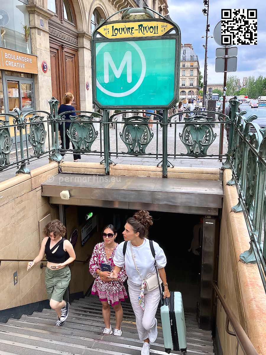 France Paris Metro stairs woman carrying luggage
